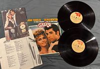 Both vinyl discs, jacket, lyric sheet, poster