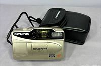 Front view of Olympus Trip XB AF44 camera and pouch