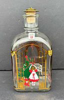 Front view showing full bottle, printed Christmas motif, stopper in place