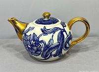 Left side view showing floral design and gold handle