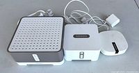 Group shot of three Sonos devices with cords