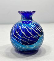 Front view showing ribbon swirl pattern and cobalt color