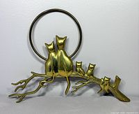 Full view of brass cat family wall hanging showing hoop, branch, five cats