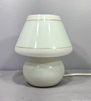 front view of white glass mushroom lamp