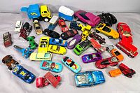Full overhead view of approximately 37 die-cast vehicles