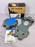 Box, pair of cleats, pamphlet