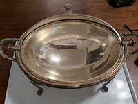 Top view of oval silver-plated server showing gilt interior and handles