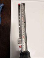 Linear rail beside ruler showing 10-inch length and carriage block