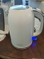 Front view of Longdeem white electric kettle with blue LED on base
