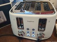 Front view of Longdeem LD-T7045A toaster showing controls and slots