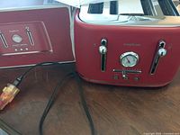 Toaster front and box showing branding and style