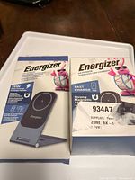 Front of both Energizer retail boxes showing models and graphics