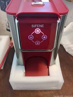 Front view of Sifene coffee maker powered on, showing control panel