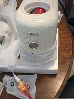 SIFENE QC2003 ivory-white vegetable chopper base with power cord and protective wrap in foam insert