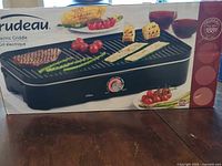 Front of Trudeau electric grill box showing product image
