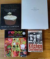 Front view of all four cookbooks showing titles and covers