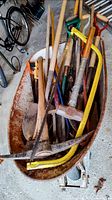 Overall lot in wheelbarrow showing multiple tools