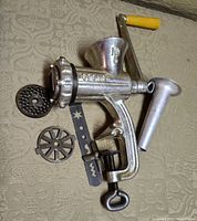 Full view of Spong No.5 grinder assembled with attachments laid out