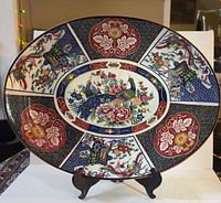 Front view of entire Imari platter on stand
