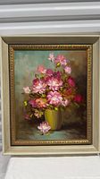 Framed oil painting of roses in vase