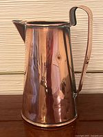 Full profile of copper pitcher