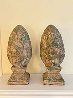 Pair of pottery pineapple finials front view