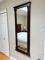 Full view of mounted wall mirror showing size and style
