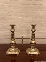 pair of brass candlesticks front view