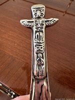 Close view of Haida totem design on handle end of spoon