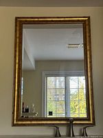 Full view of mirror hung on wall