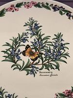 Central herb and butterfly motif on plate