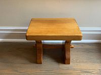 Top view of pine footstool showing rectangular surface and finish
