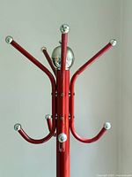 close-up of upper hooks and chrome finials