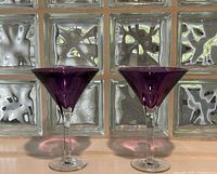 Front view of both purple Waterford martini glasses