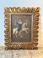 Framed oil painting on wood panel showing entire item