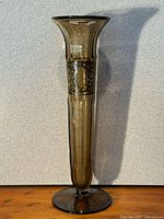 Full view of tall smoky glass vase front