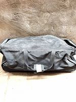 Top view of black TUMI duffle bag