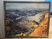 Full view of framed landscape painting