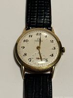 Front view of Omega watch showing dial, hands, strap