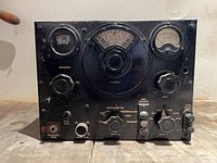 Front view showing meters, main dial, controls, connectors