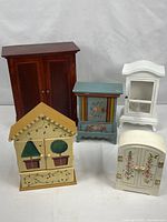 Group shot of all five miniature wooden cabinets