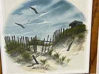 Close-up of artwork illustrating detail of dunes, fence and seagulls