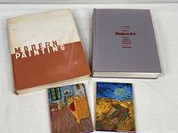 Group shot of both books and two notecard folios