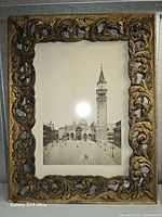 Front view showing gilt frame and photograph