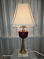 Lamp lit with shade attached showing overall appearance