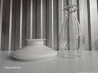 Milk glass shade ring and clear glass chimney side by side