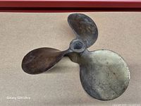 Oblique view showing overall propeller form and patina