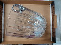 Side view of Mikasa crystal ice bucket lying in box