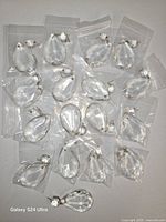 Prisms spread out individually in plastic sleeves