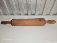 Top view of full rolling pin showing handles and cylinder